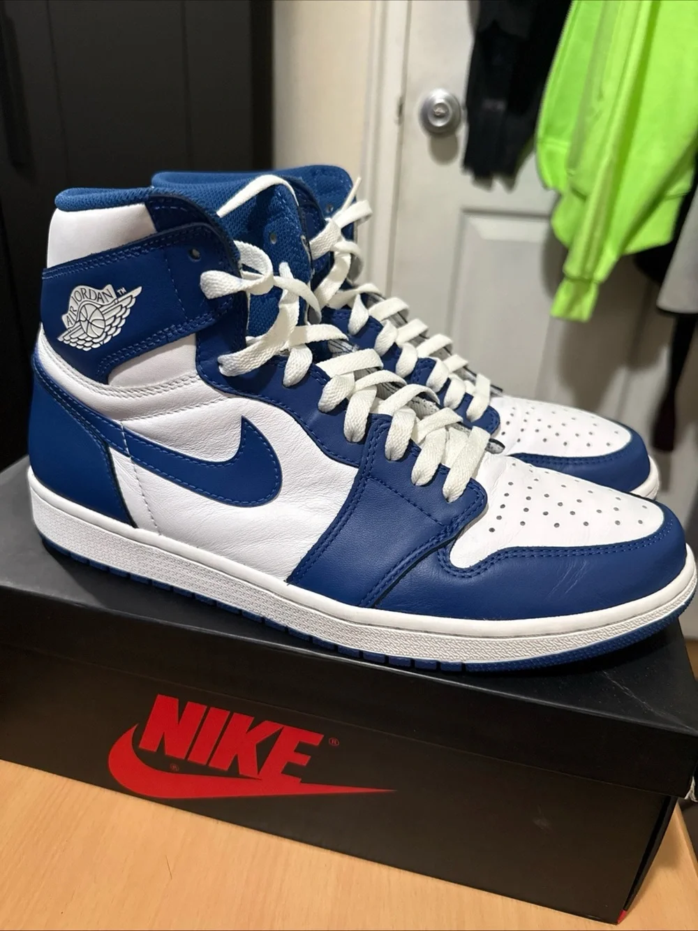 Jordan Air Jordan 1 Mid White and Blue Sneakers